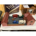 A MODEL OF A FARMHOUSE AND STABLE BLOCK WITH A LANDROVER AND HORSEBOX AND A CAR AND CARAVAN