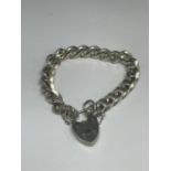 A HEAVY MARKED SILVER BRACELET WITH A HEART LOCK