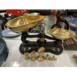 A SET OF VINTAGE LIBRA CAST AND BRASS SCALES WITH WEIGHTS