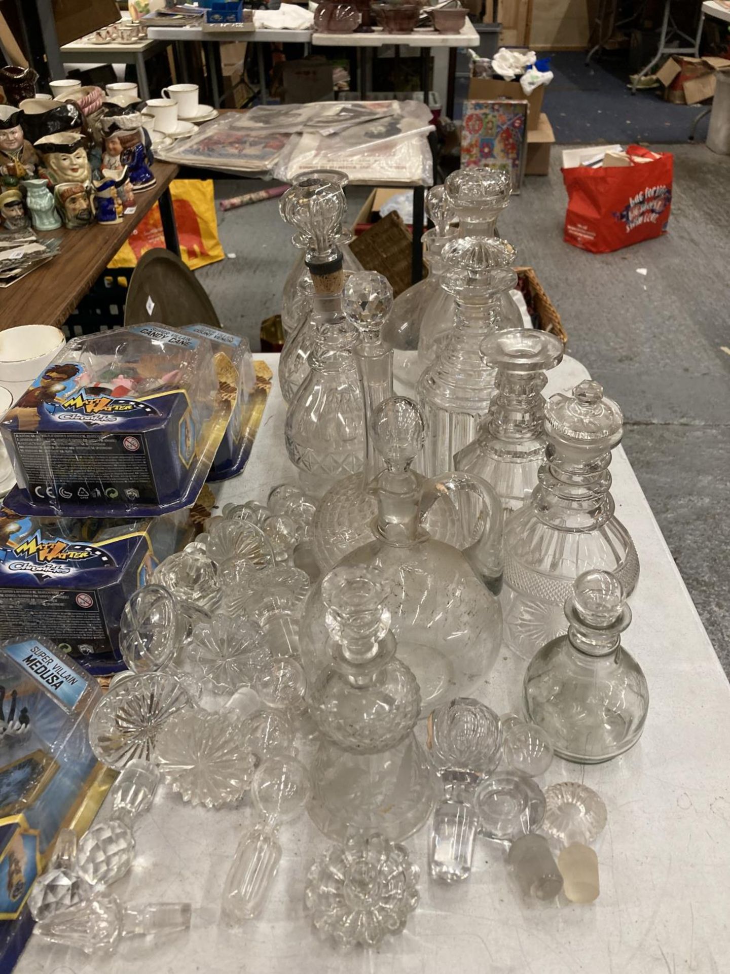 A QUANTITY OF VINTAGE DECANTERS PLUS AN AMOUNT OF DECANTER STOPPERS