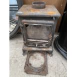 A VINTAGE CAST IRON LOG BURNER