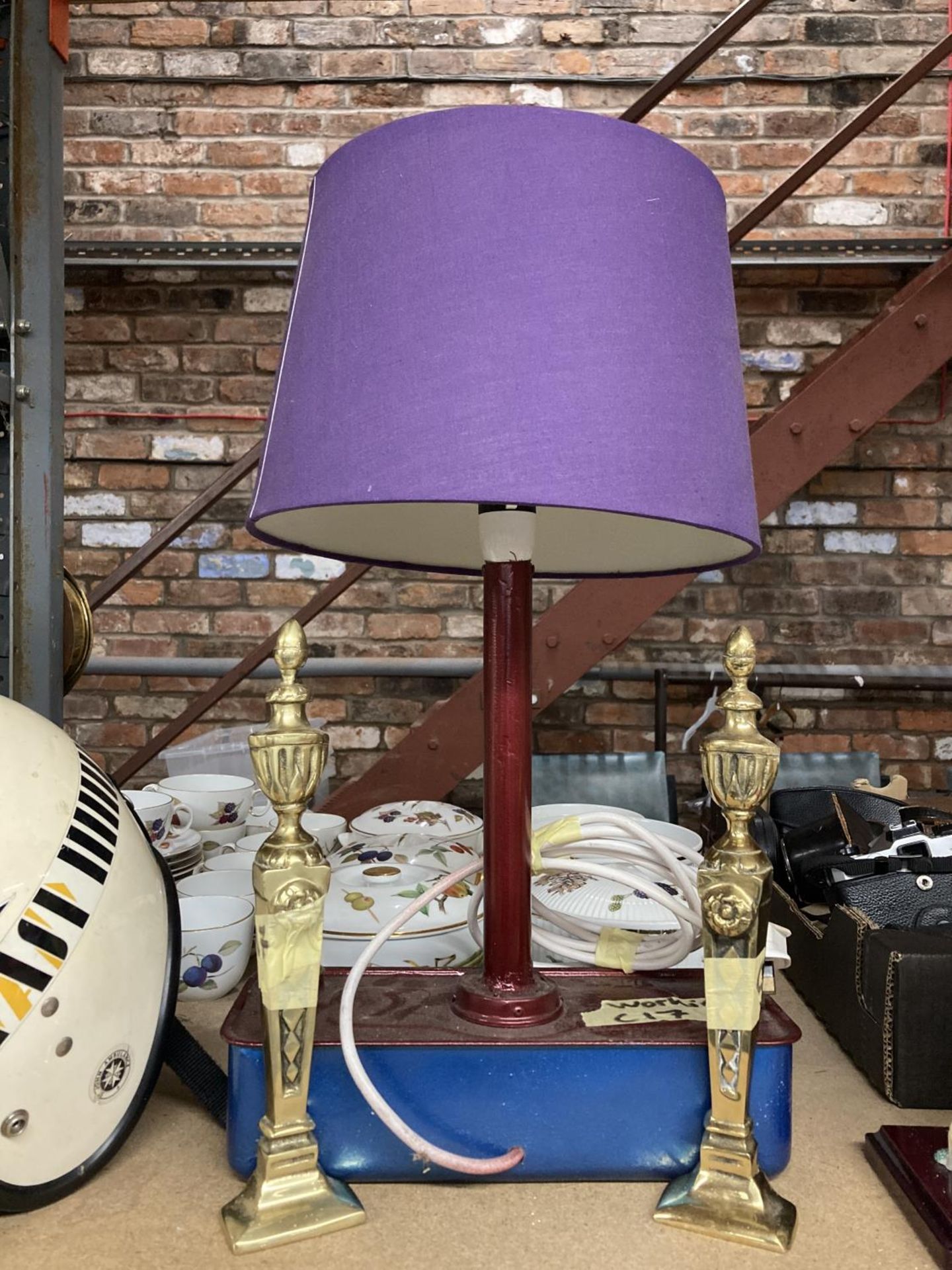 A FUEL TANK CONVERTED TO A LAMP AND A PAIR OF BRASS FIRE DOG ENDS