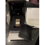 A BOXED VERSACE WRIST WATCH WITH PERALISED RECTANGULAR FACE SOFT BAG ETC