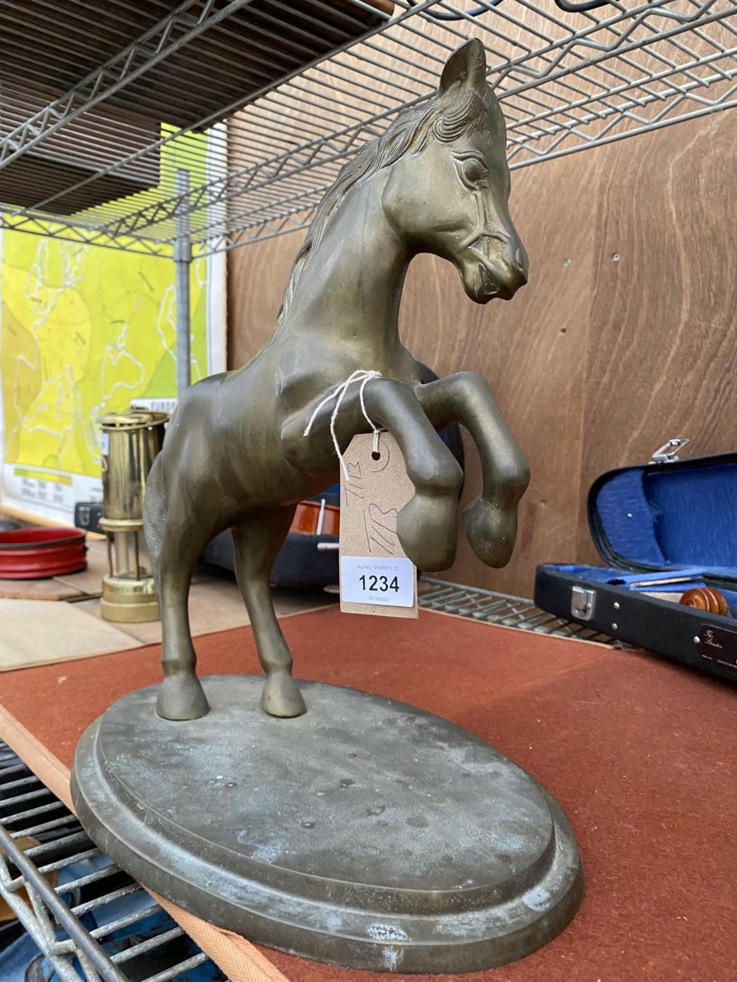 A LARGE BRASS REARING HORSE WITH BRASS BASE (H:34CM)