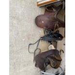 AN ASSORTMENT OF HORSE TACK TO INCLUDE TWO LEATHER SADDLES AND STIRRUPS ETC