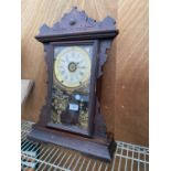 A VINTAGE WOODEN CASED WALL CLOCK