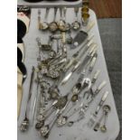 A QUANTITY OF FLATWARE TO INCLUDE MUSTARD SPOONS, SERVING SPOONS, SUGAR SIFTER LADLE, MUFFIN