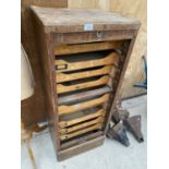 A VINTAGE WOODEN FILING TRAY CABINET WITH TAMBOUR FRONT AND NINE INTERNAL TRAYS