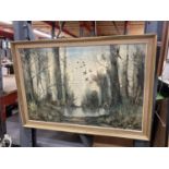 A FRAMED OIL ON CANVAS OF A WOODLAND LAKE 83CM X 58CM