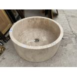 A CREAM SOLID MARBLE WASH BASIN