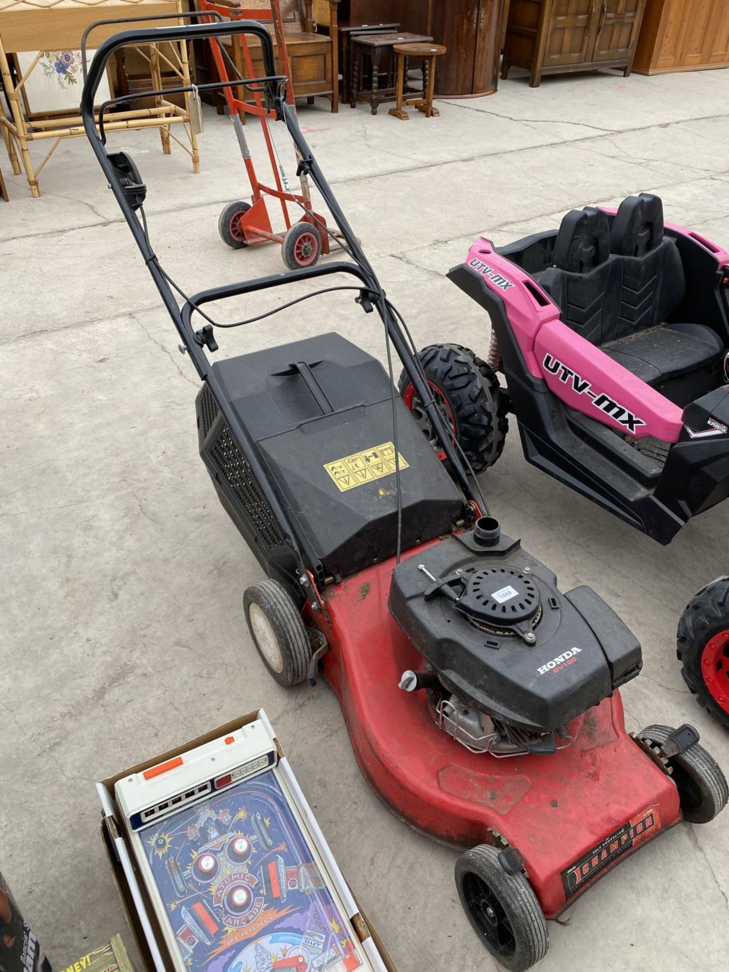A CHAMPION LAWN MOWER WITH HONDA PETROL ENGINE AND GRASS BOX