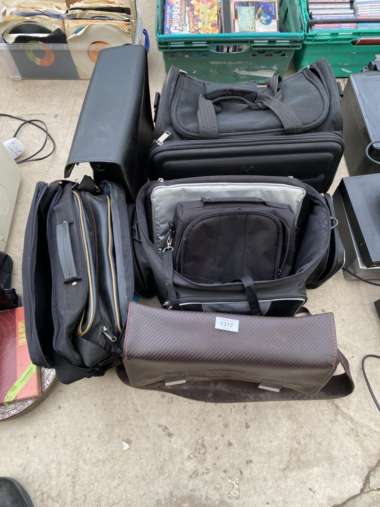 AN ASSORTMENT OF EMPTY CAMERA AND CAMCORDER BAGS