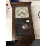 A VINTAGE WALL CLOCK IN A MAHOGANY CASE WITH PENDULUM AND KEY