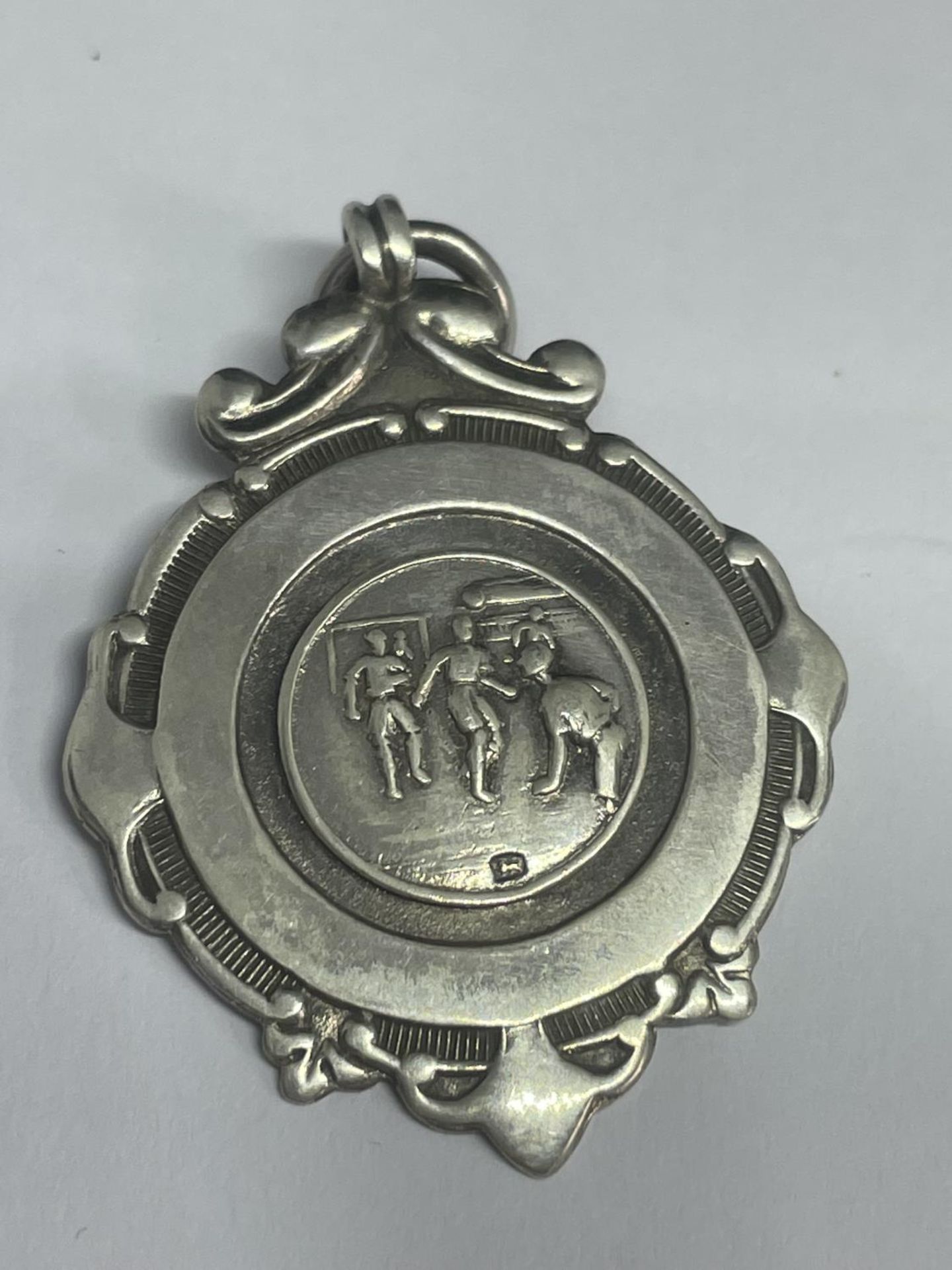 A HALLMARKED BIRMINGHAM SILVER FOOTBALL MEDAL 1946 - 1947