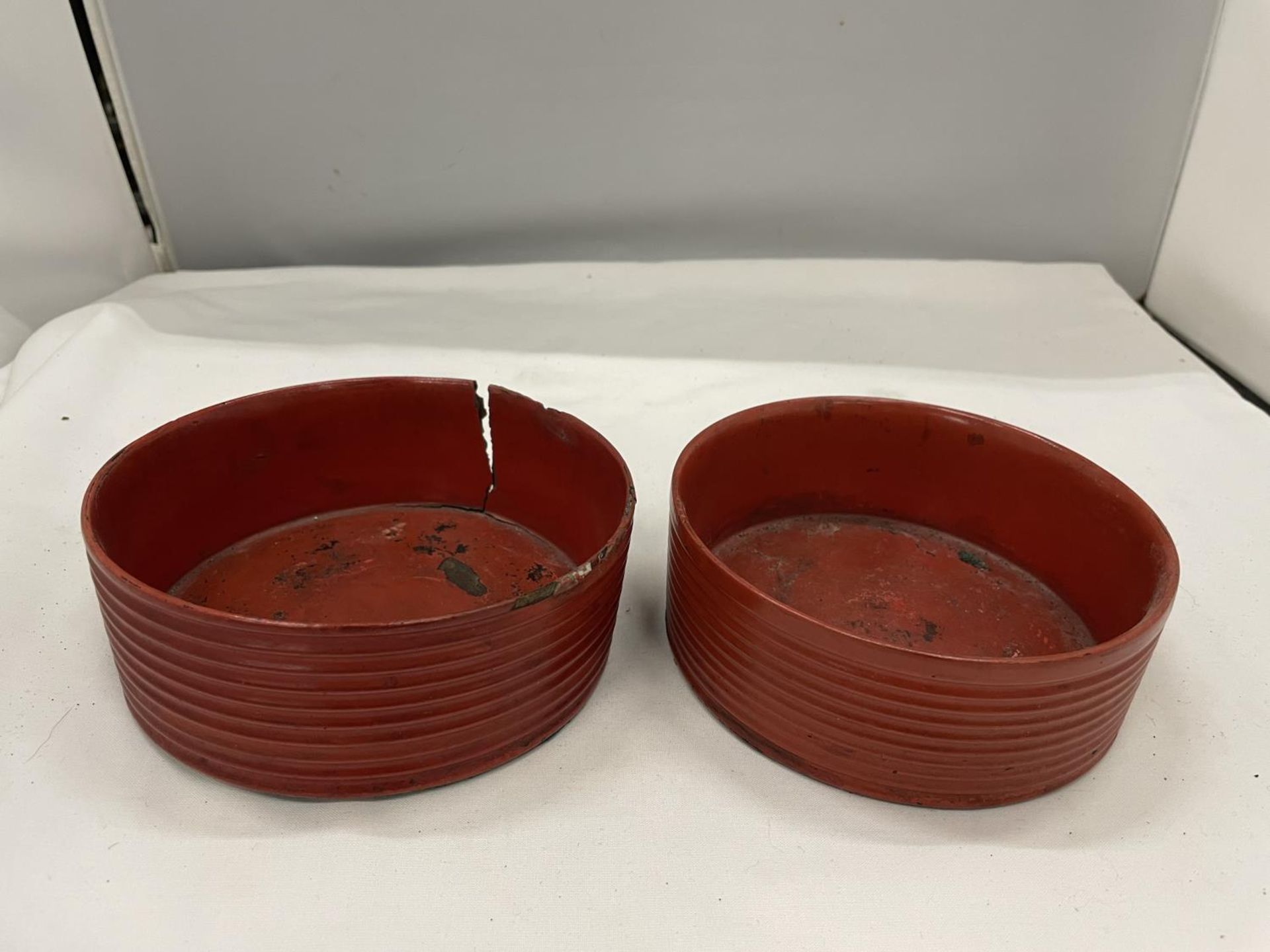 A NEAR PAIR OF BELIEVED ENGLISH REGENCY CIRCA 19TH CENTURY WINE COASTERS IN CINNABAR RED LACQUER