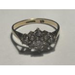 A 9 CARAT GOLD RING WITH NINE CUBIC ZIRCONIAS SET IN A DIAMOND DESIGN SIZE L