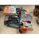 AN ASSORTMENT OF POWER TOOLS TO INCLUDE A BLACK AND DECKER HEAT GUN, A BLACK AND DECKER JIGSAW AND A