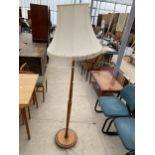 A MODERN BEECH STANDARD LAMP ON TURNED COLUMN, COMPLETE WITH SHADE