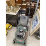 A QUADTRAK 45 SELF PROPELLED PETROL LAWN MOWER WITH GRASS BOX