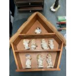 A WOODEN HOUSE SHAPED DISPLAY CASE CONTAINING LENNOX DISNEY MODELS OF SNOW WHITE AND THE SEVEN