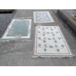 A CHINESE RUG AND TWO OTHERS