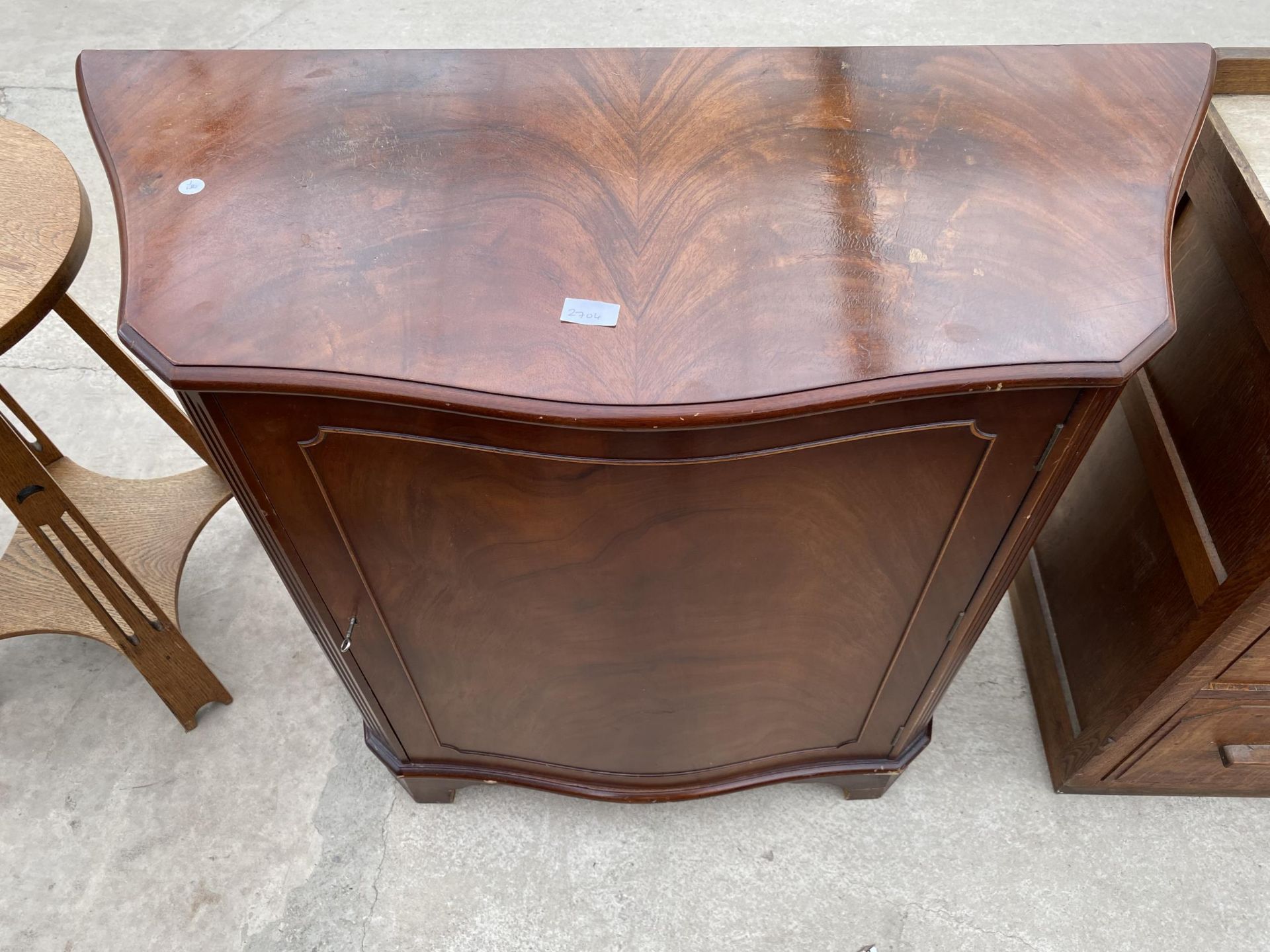 A MAHOGANY SERPENTINE FRONTED SIDE CABINET, 40" WIDE