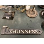 A CAST 'GUINNESS' SIGN LENGTH 39CM