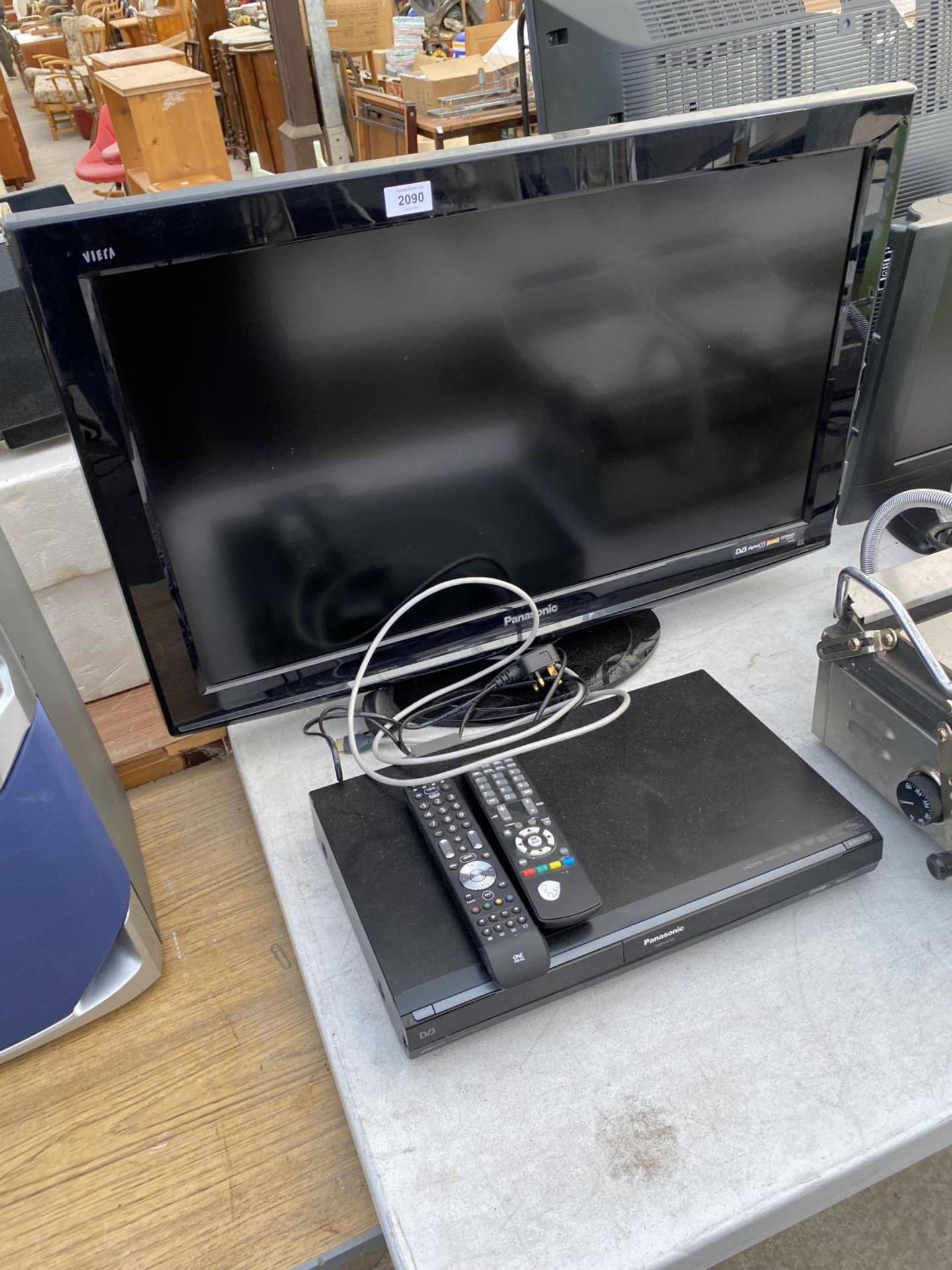 A PANASONIC 32" TELEVISION WITH REMOTE CONTROL AND A PANASONIC DVD PLAYER