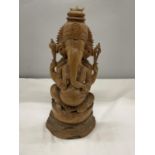 A CARVED WOOD GANESHA FIGURE