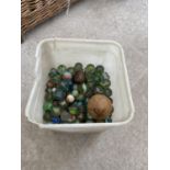 A BOX CONTAINING VINTAGE GLASS MARBLES