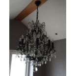 A MODERN CHANDELIER STYLE EIGHT BRANCH LIGHT FITTING WITH GLASS DROPLETS