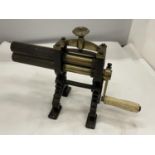 A VICTORIAN BRASS AND CAST CRIMPING MACHINE FOR PLEATING AND RUFFLING LAUNDERED AND STARCHED CUFFS