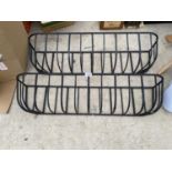 A PAIR OF HEAVY WROUGHT IRON HAYRACK PLANTERS