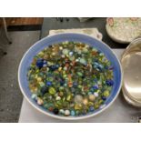 A LARGE BOWL CONTAINING A QUANTITY OF VINTAGE GLASS MARBLES