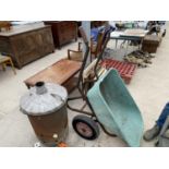 A TWO WHEELED BARROW AND A GARDEN BURNER