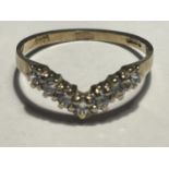 A 9 CARAT GOLD WISHBONE RING WITH CUBIC ZIRCONIAS SIZE L