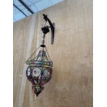 A MOROCCAN PENDANT LIGHT WITH FACETTED GLASS