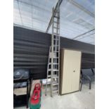 A 28 RUNG ALUMINIUM TWO SECTION EXTENDABLE LADDER AND A FIVE RUNG STEP LADDER