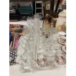 A QUANTITY OF GLASSES TO INCLUDE CHAMPAGNE FLUTES, WINE, BRANDY, PORT, ETC