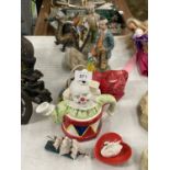 A QUANTITY OF ITEMS TO INCLUDE A CLOWN AND DRAGON TEAPOT, CLOWNS, PARROTS, CHICKENS, A DRAGON, ETC