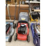 A PETROL ENGINE LAWN MOWER WITH GRASS BOX BELIEVED IN WORKING ORDER BUT NO WARRANTY