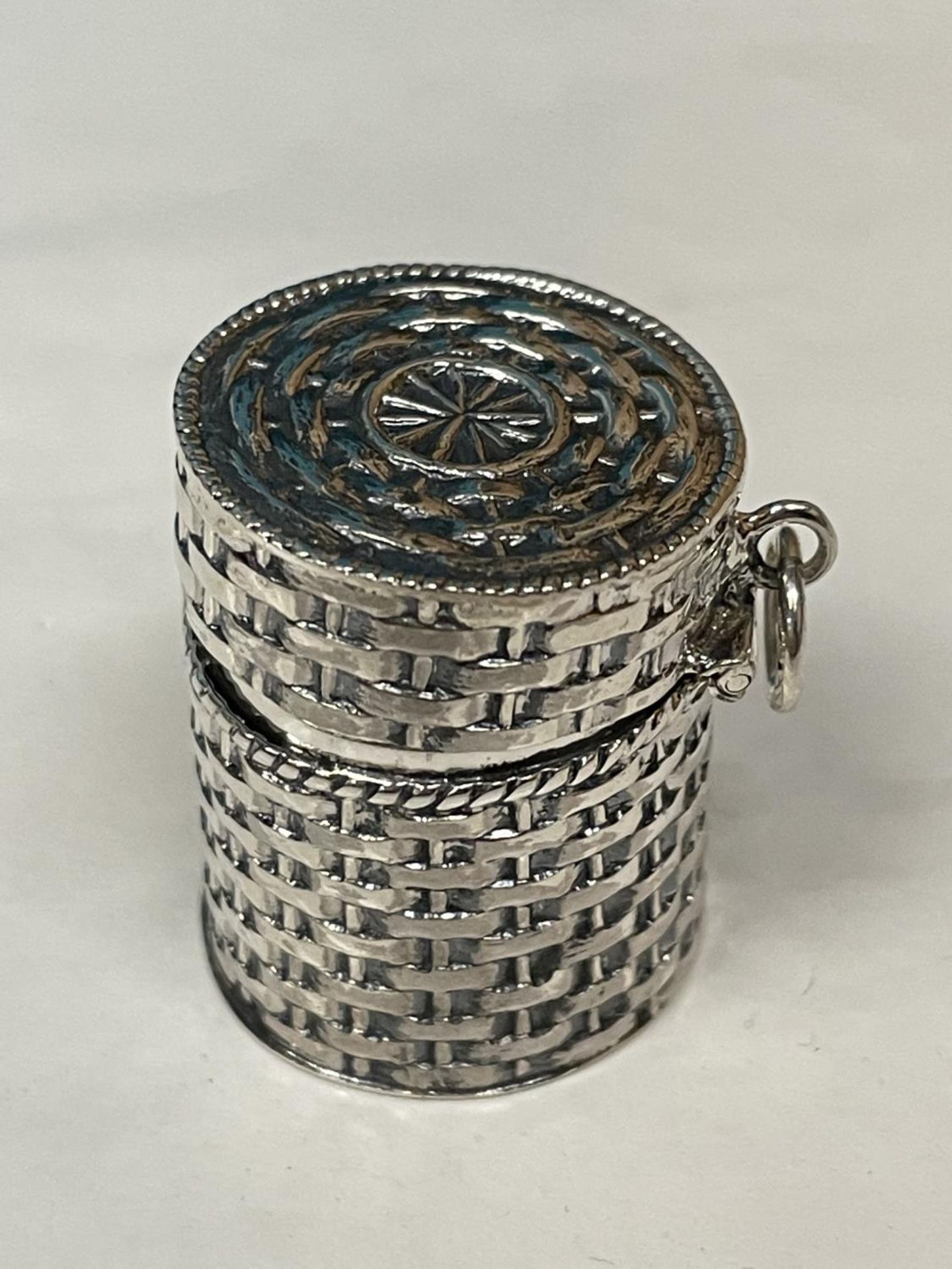 A MARKED SILVER THIMBLE CASE IN THE GUISE OF A BASKET