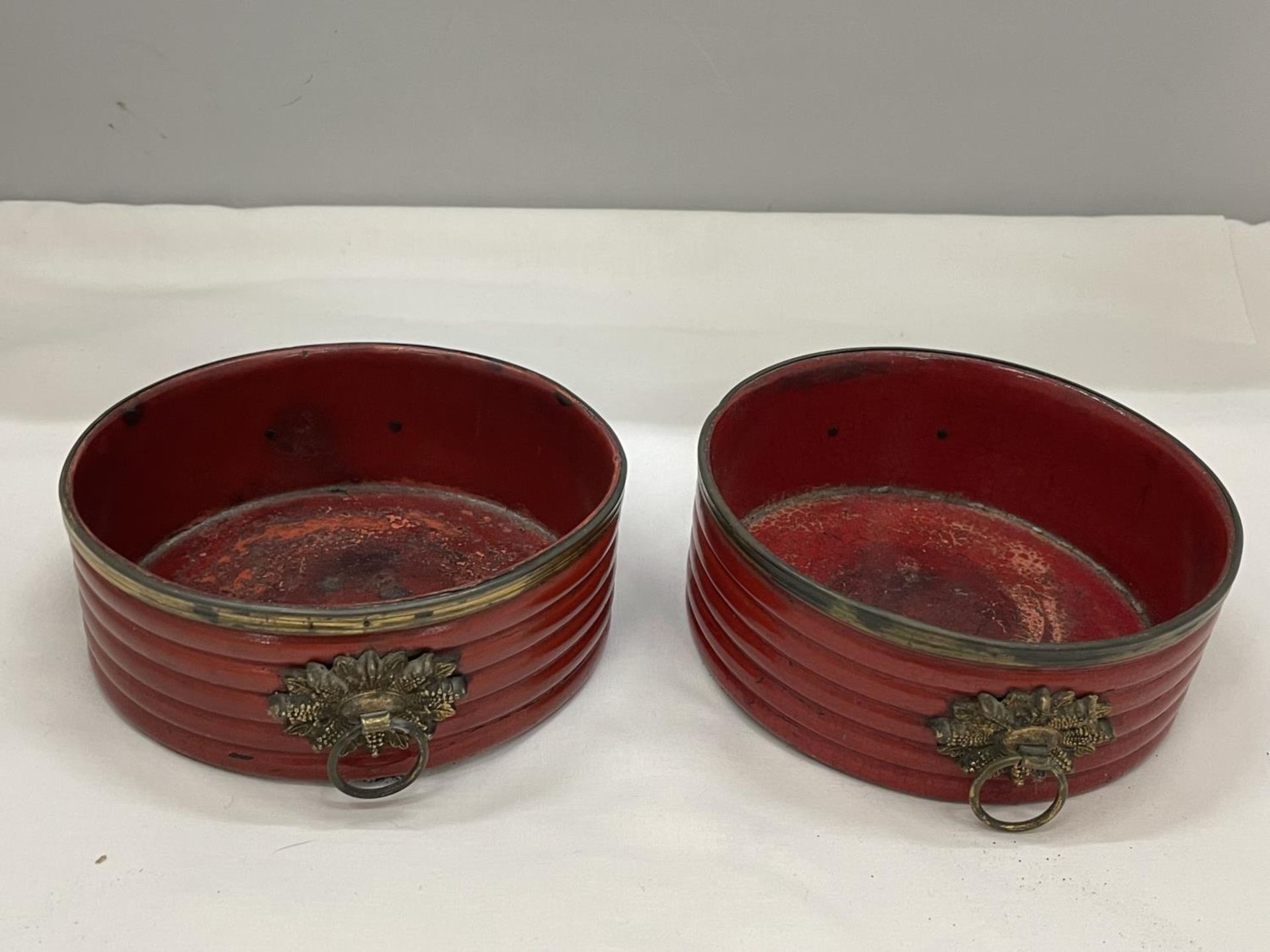 A PAIR OF BELIEVED ENGLISH REGENCY CIRCA 19TH CENTURY WINE COASTERS IN CINNABAR RED LACQUER WITH