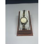 AN INGERSOL WRIST WATCH IN A PRESENTATION BOX