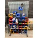 A WORKSHOP DISPLAY BOARD WITH A LARGE ASSORTMENT OF LIN BINS CONTAINING HARDWARE AND TOOLS ETC