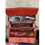 A METAL DRAPER TOOL BOX CONTAINING SPANNERS AND SOCKETS ETC