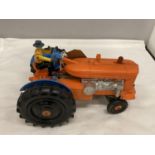 A BATTERY POWERED PLASTIC MODEL OF A VINTAGE TRACTOR