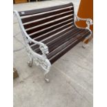 A WOODEN SLATTED GARDEN BENCH WITH CAST IRON LION HEAD BENCH ENDS