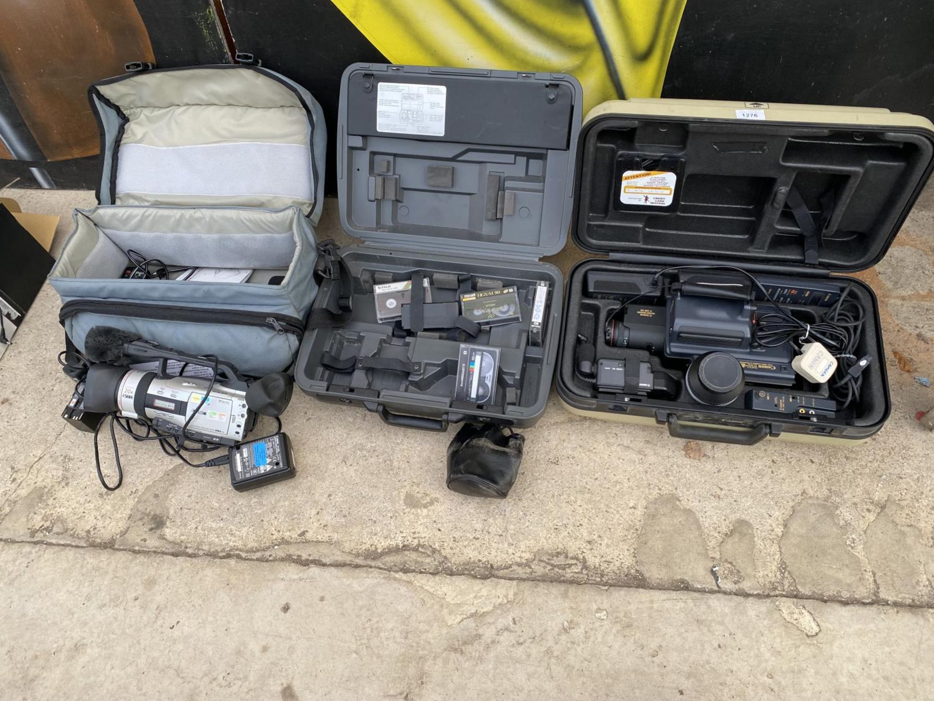 AN ASSORTMENT OF CAMERA EQUIPMENT TO INCLUDE TWO CANON CAMCORDERS AND CARRY CASES ETC