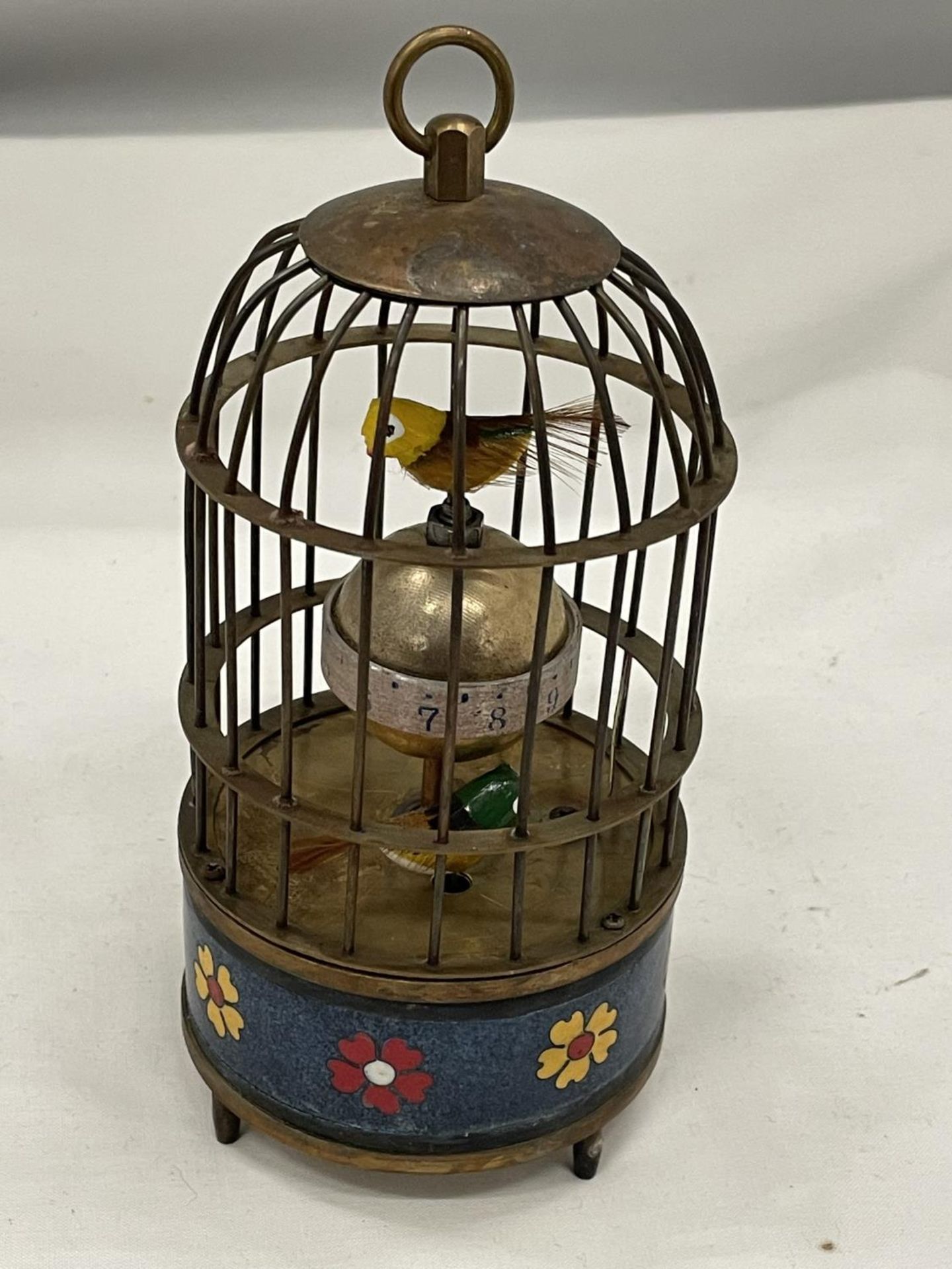 A BRASS BIRD CAGE CLOCK